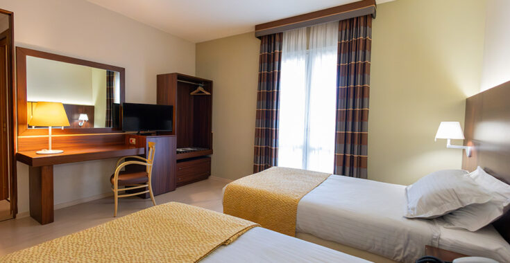 Standard twin room interior at Delfina Palace Hotel